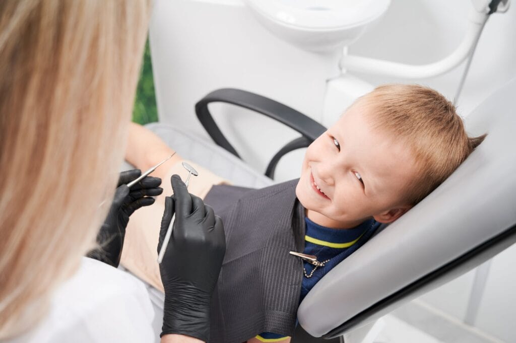 young child smiling preparing for treatment