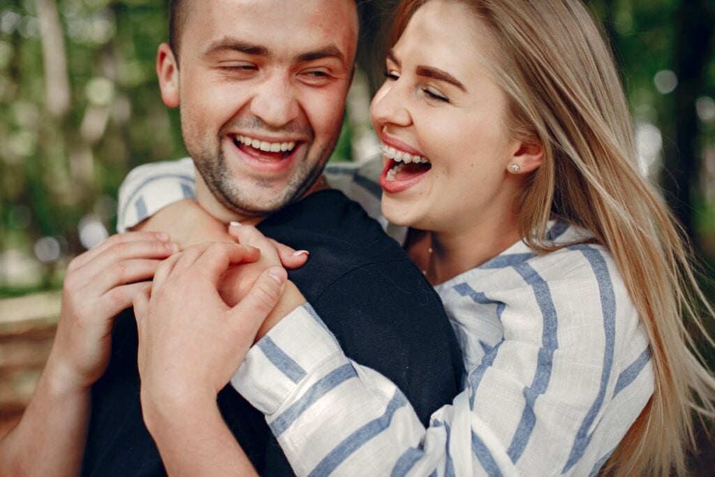 Happy young couple with beautiful smiles