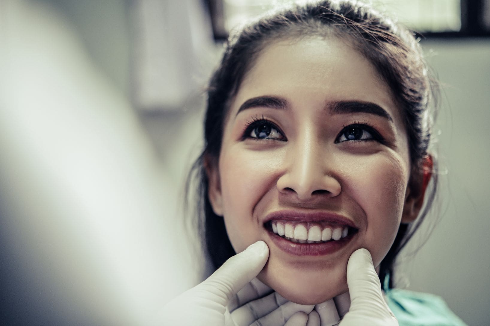 young patient smiling for orthodontist during treatment