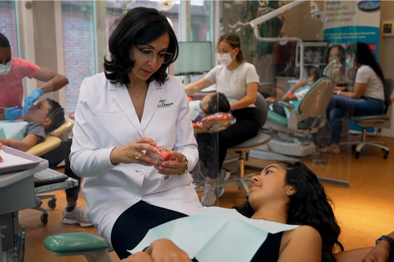 Dr. Gellerman shares orthodontic appliance instructions with a patient.
